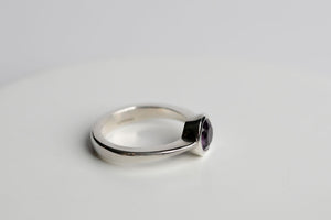 Sterling silver 7mm round faceted amethyst bezel set solitaire ring by Brian Bibeau Designs.