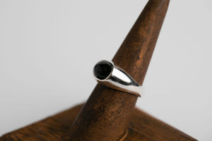 Sterling silver 10mm x 8mm oval cabochon Oregon black agate bezel set signet ring by Brian Bibeau Designs.