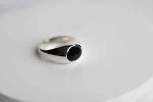 Sterling silver 10mm x 8mm oval cabochon Oregon black agate bezel set signet ring by Brian Bibeau Designs.