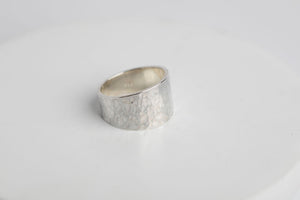 Sterling silver cigar band with a textured, hammered finish ring by Brian Bibeau Designs.