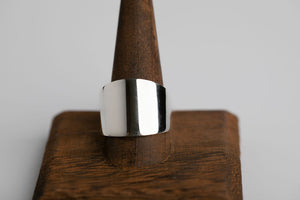 Sterling silver cigar wide band ring with a smooth, polished finish by Brian Bibeau Designs.