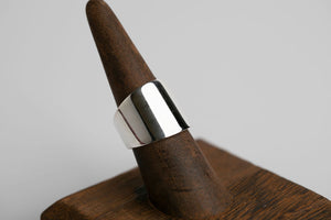 Sterling silver cigar wide band ring with a smooth, polished finish by Brian Bibeau Designs.