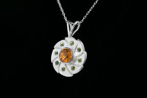 Sterling silver 10mm round vortex cut citrine bezel set pendant flanked with 8 green peridot by Brian Bibeau Designs.