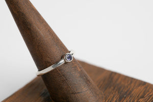 Iolite Round Stacker Ring: Sterling silver 3mm round cabochon iolite bezel set ring by Brian Bibeau Designs. 