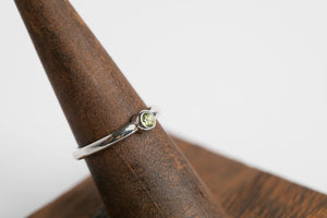 Peridot Round Stacker: Sterling silver 3mm round cabochon peridot bezel set ring by Brian Bibeau Designs.