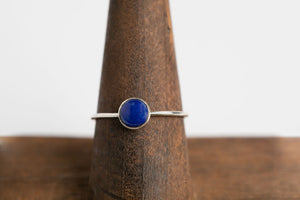 Lapis Lazuli Round Stacker: Sterling silver 1mm wire band, 6mm round cabochon lapis lazuli bezel set ring by Brian Bibeau Designs.