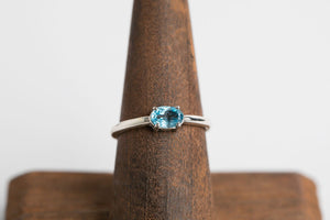 Swiss Blue Oval Stacker: Sterling silver 4x6 oval faceted swiss blue topaz 4 prong set ring by Brain Bibeau Designs.