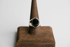 Sterling silver 16mm x 12mm oval cabochon Oregon black agate bezel set signet ring by Brian Bibeau Designs.