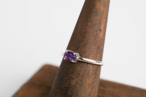 Amethyst Oval Stacker: Sterling silver 4x6 oval faceted amethyst 4 prong set ring by Brian Bibeau Designs.