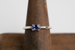 Iolite Oval Stacker: Sterling silver 4x6 oval faceted iolite 4 prong set ring by Brian Bibeau Designs.