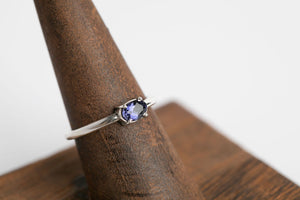 Iolite Oval Stacker: Sterling silver 4x6 oval faceted iolite 4 prong set ring by Brian Bibeau Designs.