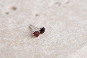 Sterling silver 4mm round cabochon red garnet earrings scalloped bezel set by Brian Bibeau Designs.