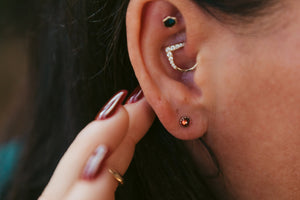 Sterling silver 4mm round cabochon red garnet earrings scalloped bezel set by Brian Bibeau Designs.